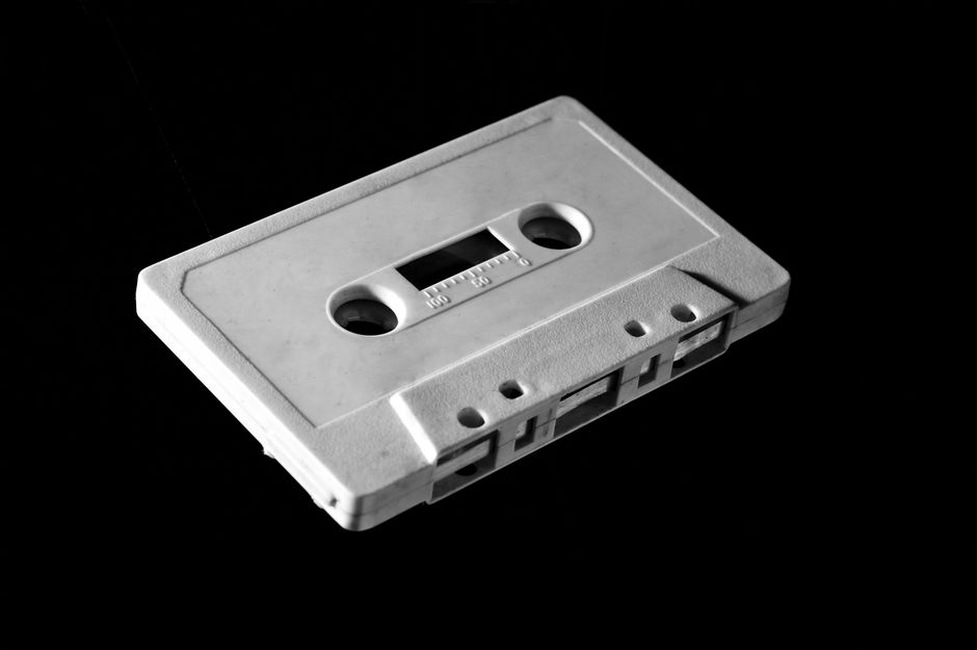 Black cassette spine with silver number 6 stamped on it