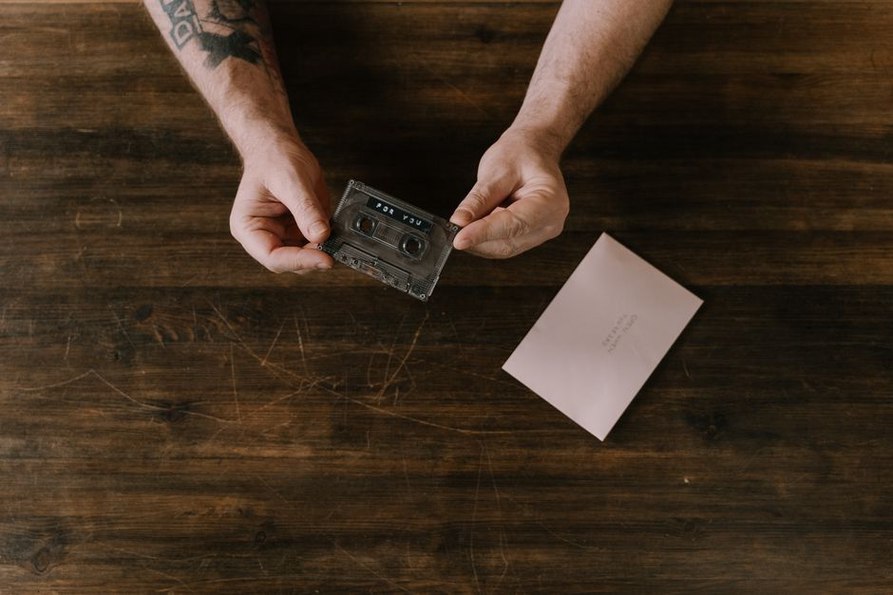 Cassette with octagon stamp lying on weathered wood