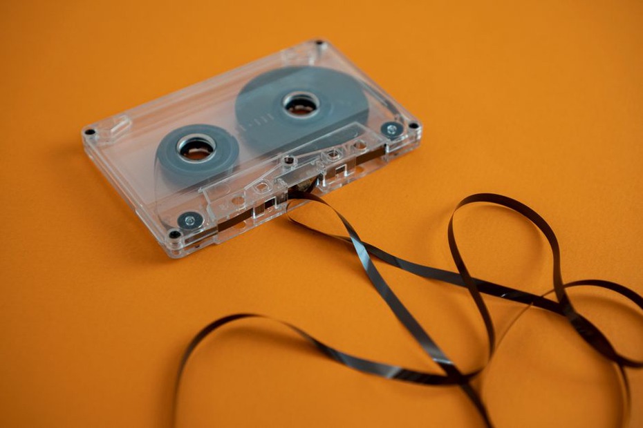 Cassette with faded handwritten label and cracked jewel case