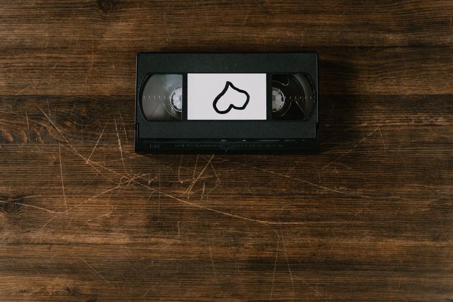 hand-numbered cassette shell with faded ink and paper wear