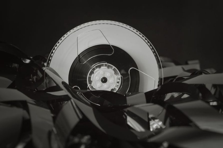 Type I ferric cassette tape spooling through a deck