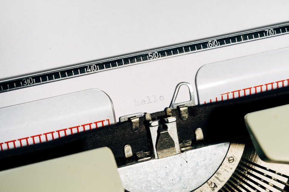 Manual typewriter imprinting catalog numbers on a blank J-card
