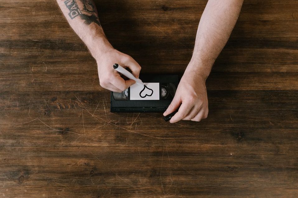 Cassette label with handwritten catalog code “p520” on textured paper