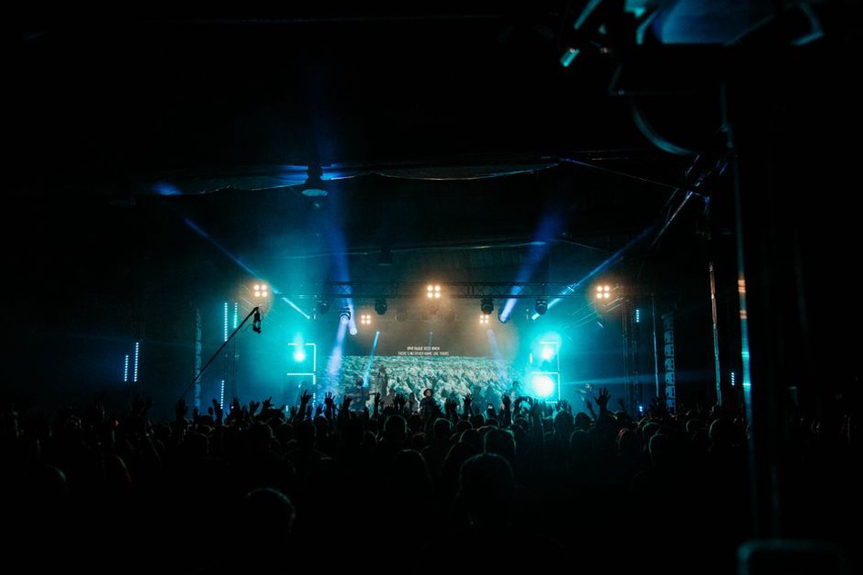 Noise artist performing live with engaged audience