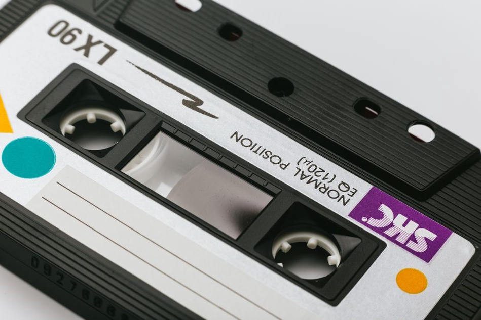 black B2 cassette with hand-stamped label on wooden table