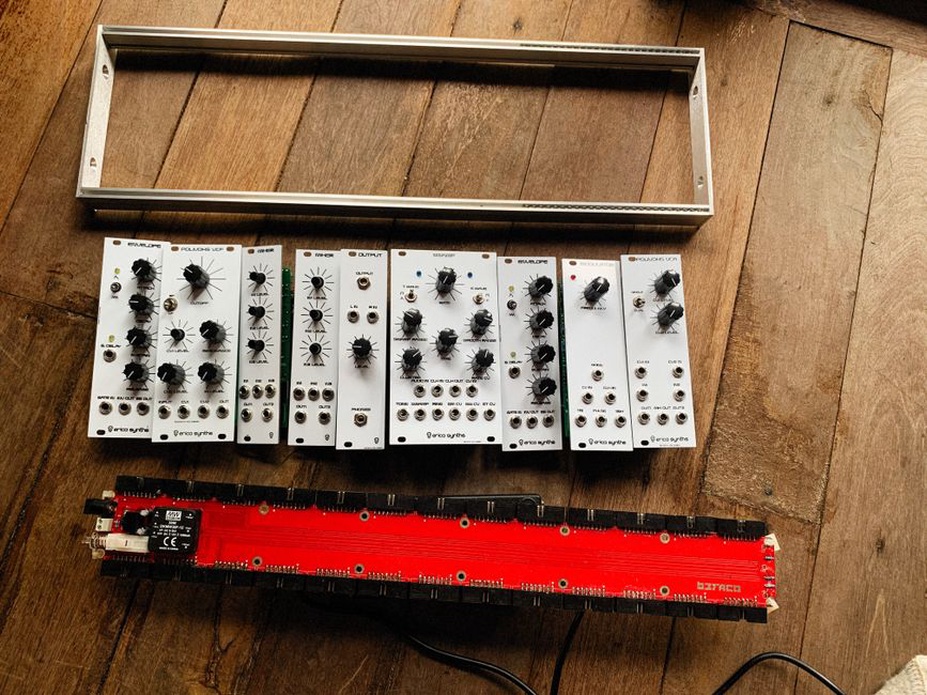 A performer using a modular synthesizer on stage