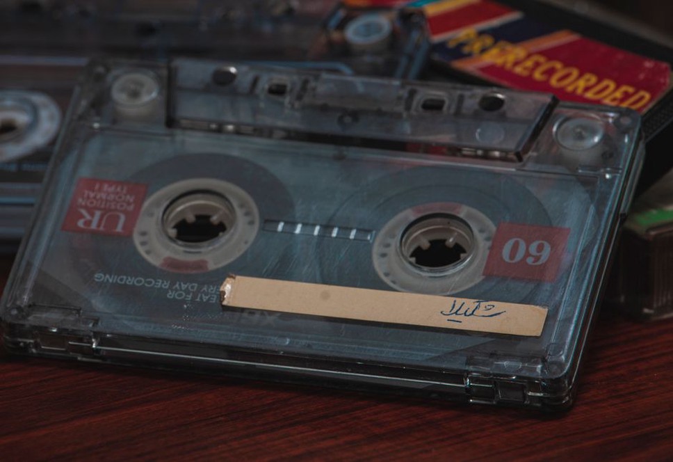 Hand-numbered cassette from an anonymous noise label on a workshop table
