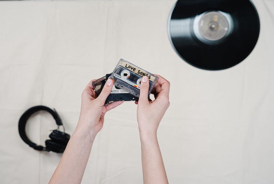 A cassette recorder beside worn listening headphones