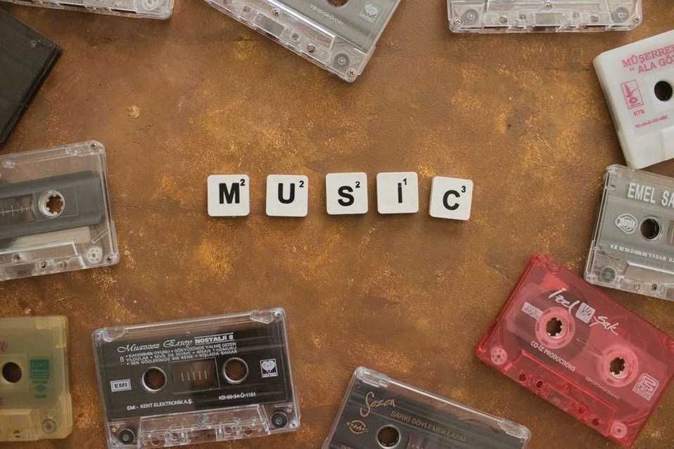 Collection of cassette tapes on a wooden table