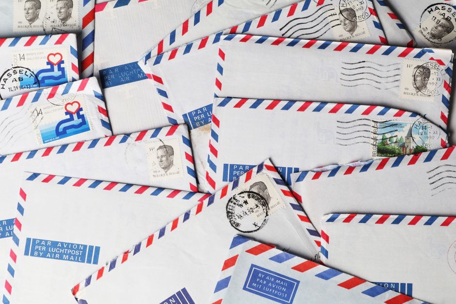 Airmail envelopes from various countries bundled together with string