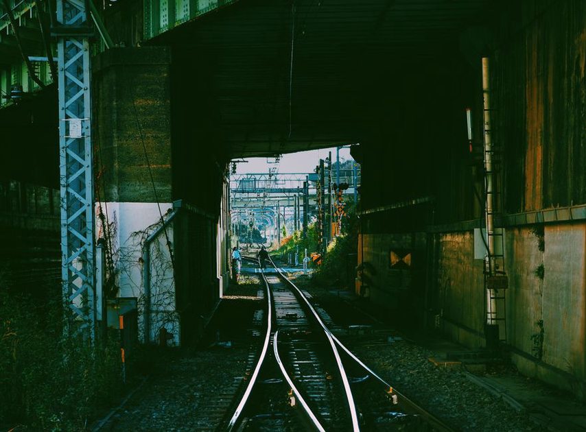 Reverberation gathers beneath a railway underpass