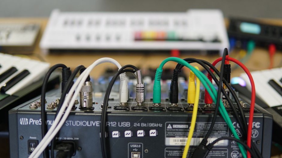 Cables and controls on a live sound table