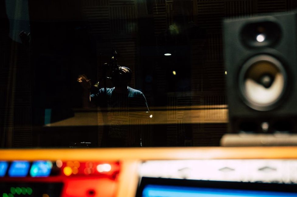Hands adjusting a mixing board during a sparse set