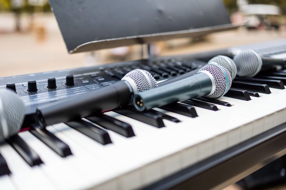 Cables, small instruments, and a mixer on a performance table