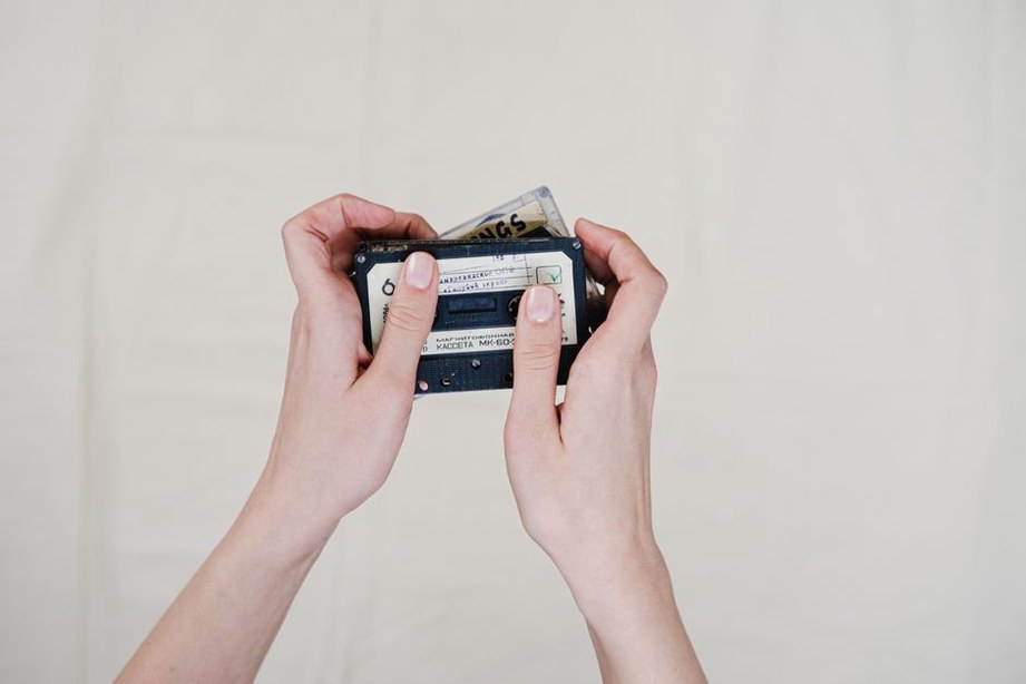 Hand-lettered insert beside an open cassette case