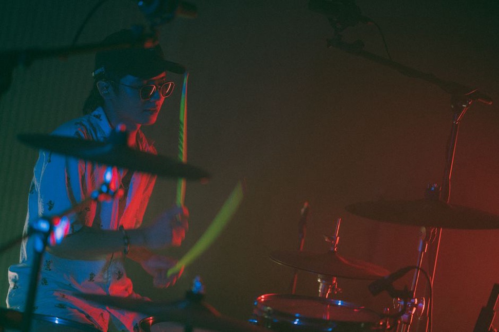 An experimental noise artist performing live with custom equipment