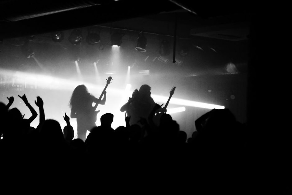 A Japanese noise artist performing amidst a chaotic soundscape