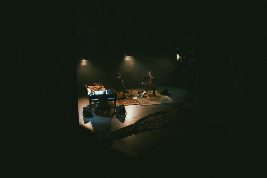 Chairs facing a compact performance area in Kyoto