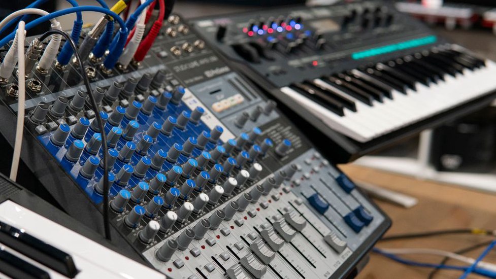 Patch cables and controls in a low-lit studio