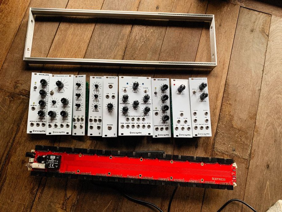 Tape machines and electronic instruments in a small studio