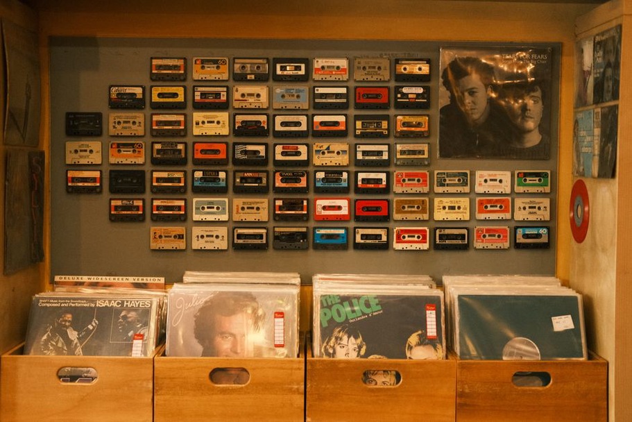 Records and tapes beside a home listening setup