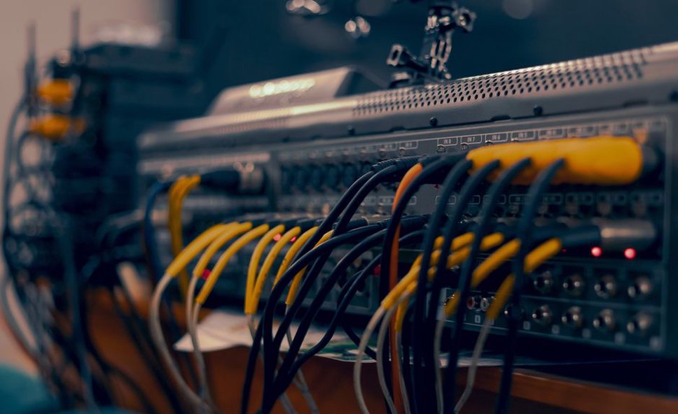 Cables and mixer controls ready for a live set