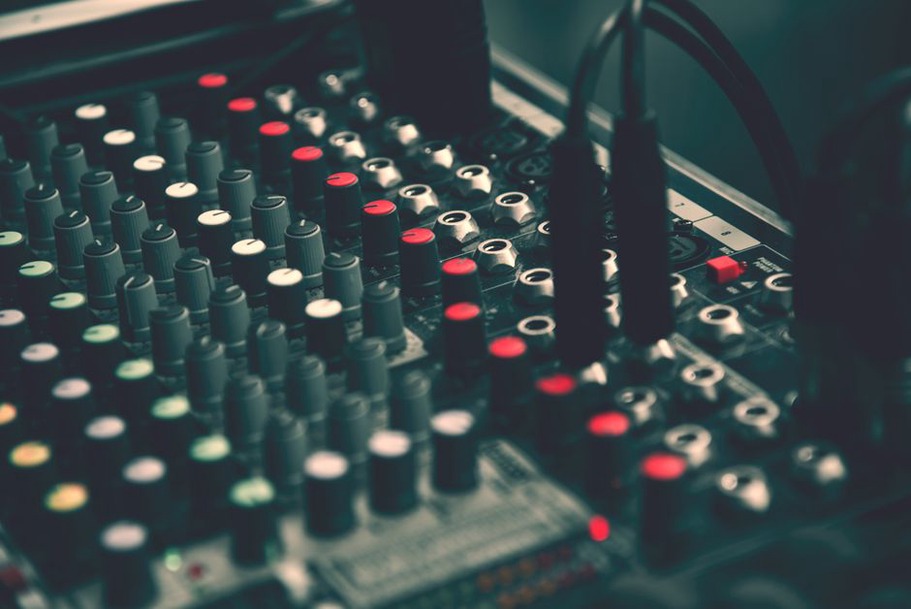 Cables loop through the controls of a mixer