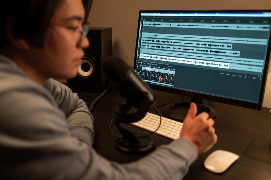 Engineer checks a recording before discussing revisions