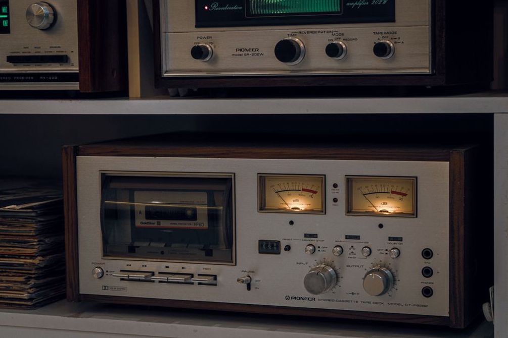 Tape deck beside handwritten session notes