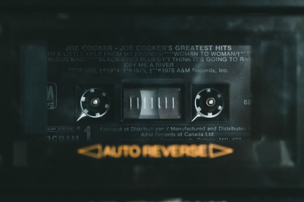 Printed insert beside an open cassette case