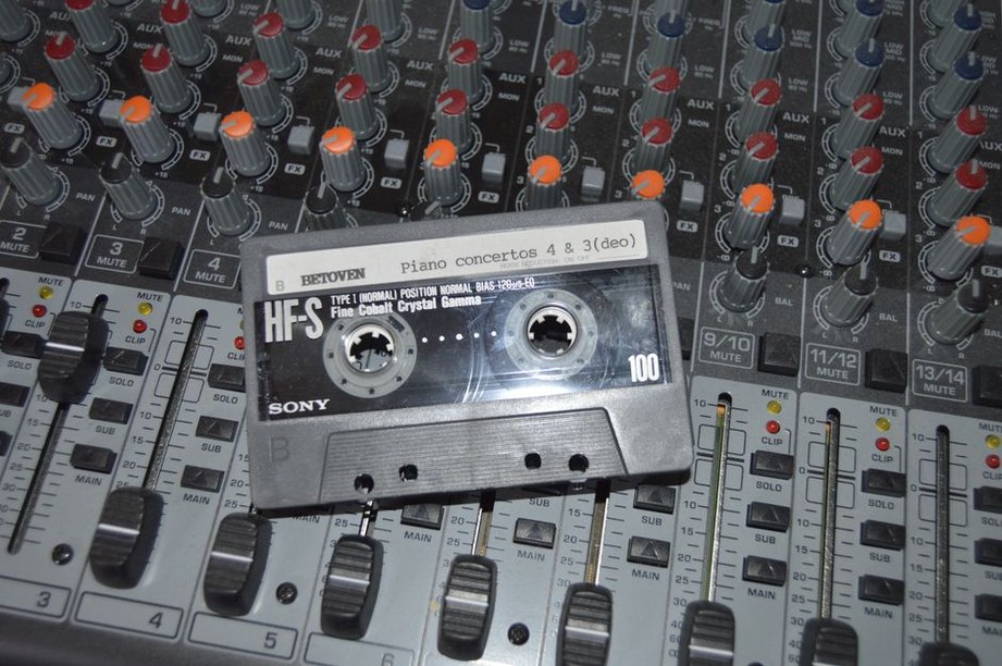 Cassettes beside cables and a compact mixer