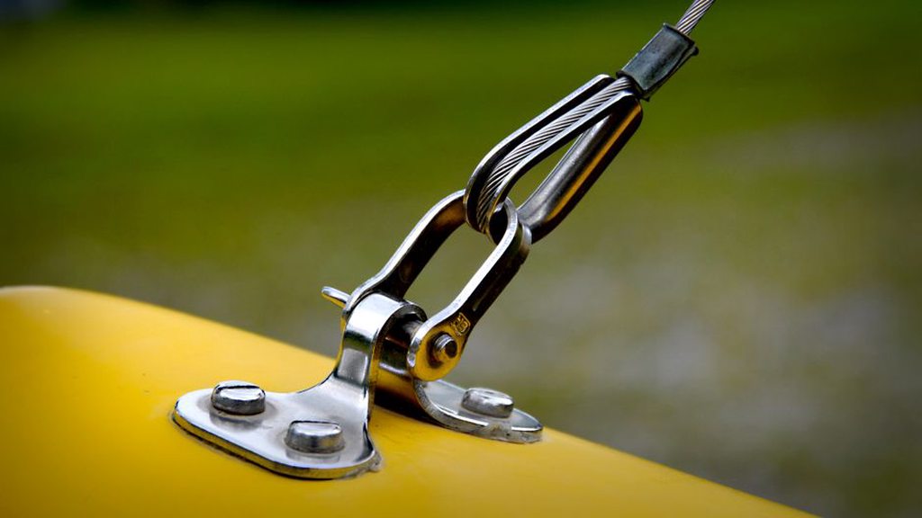 A pickup rests against a vibrating panel