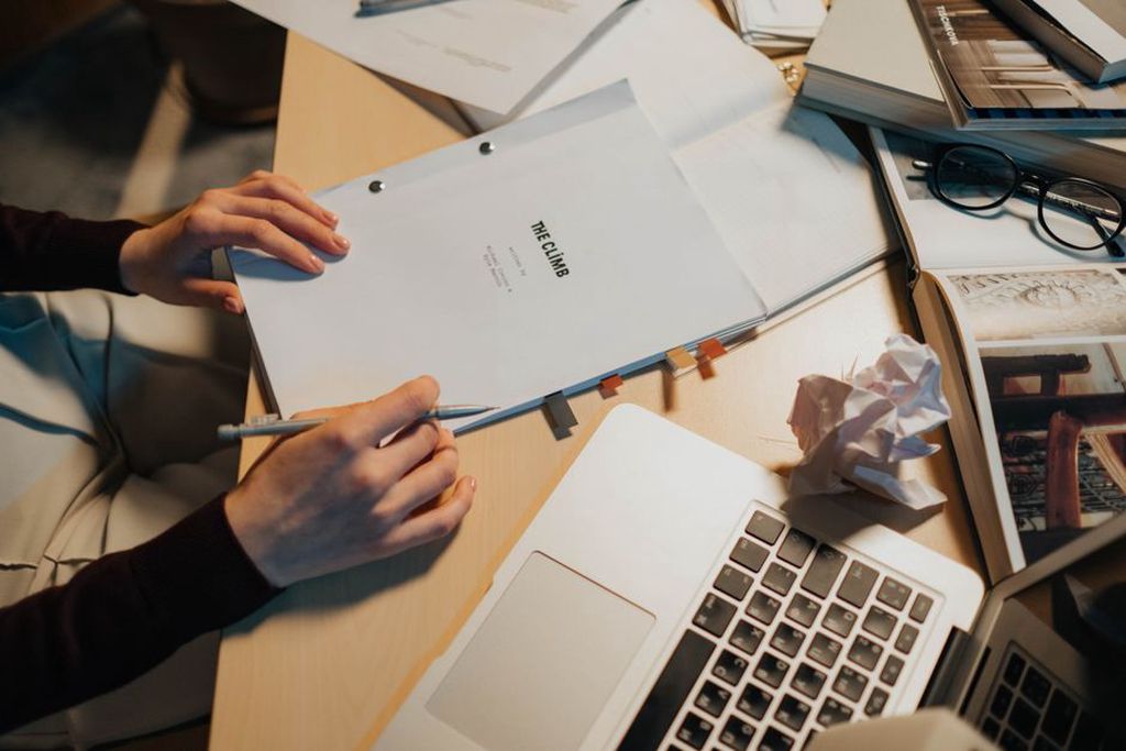 Draft headline and listening notes on a desk