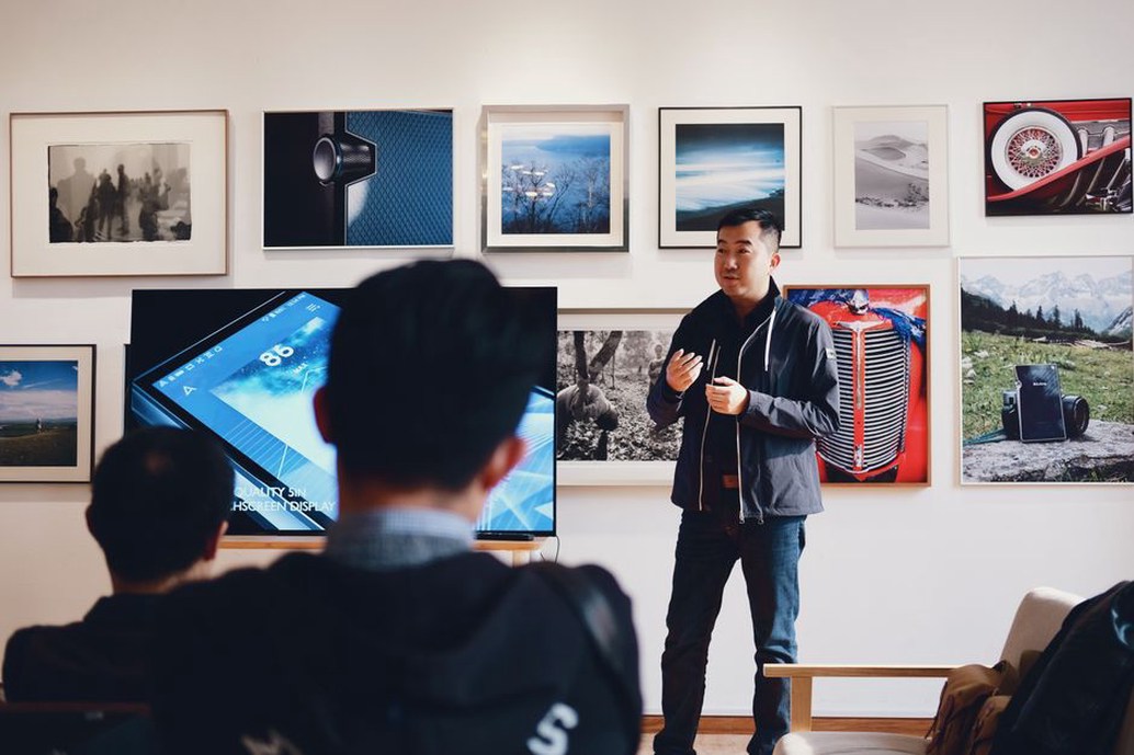 Small speakers in an otherwise open gallery room