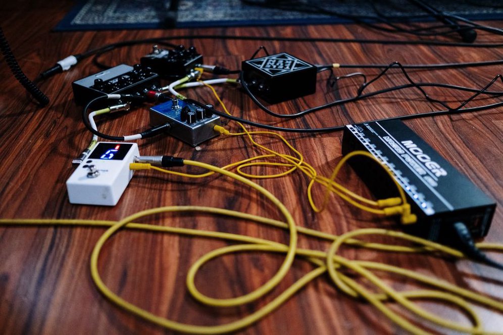 Effects pedals and cables arranged for live sound processing