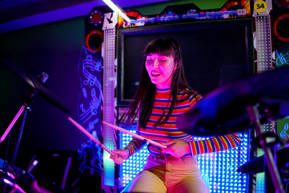 Performers negotiate space around a crowded stage