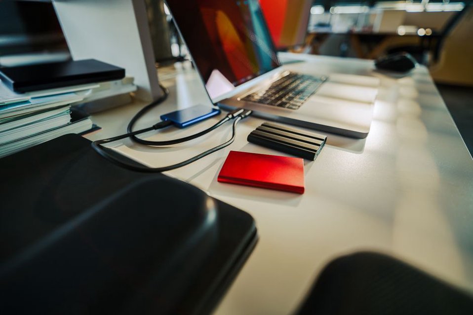 An external drive beside an open photo library