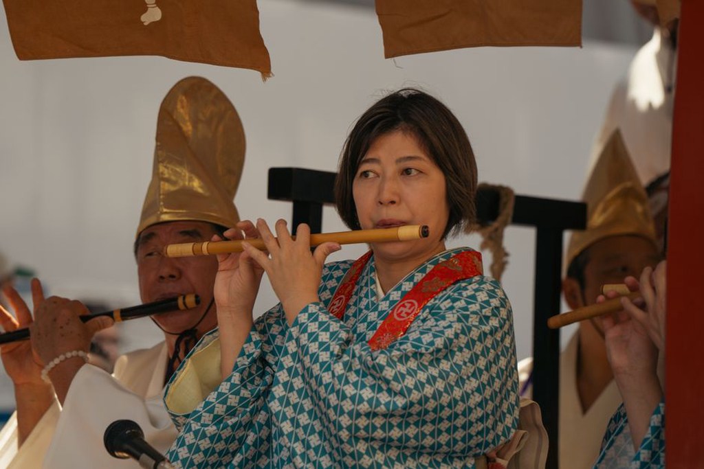 Bamboo flute with finger holes and darkened mouthpiece
