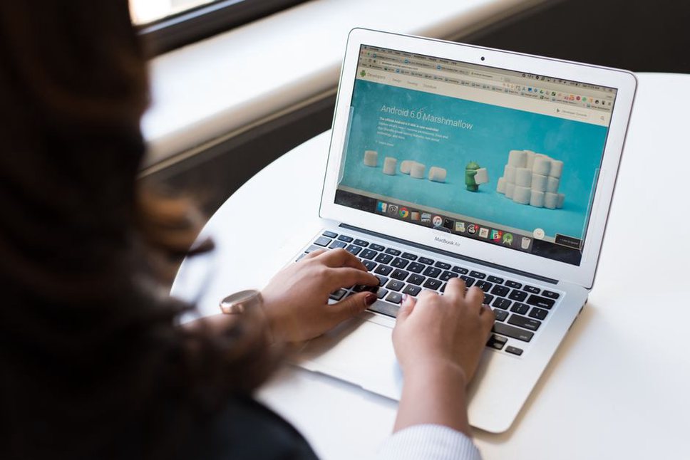 Text and a small cover image on a laptop screen