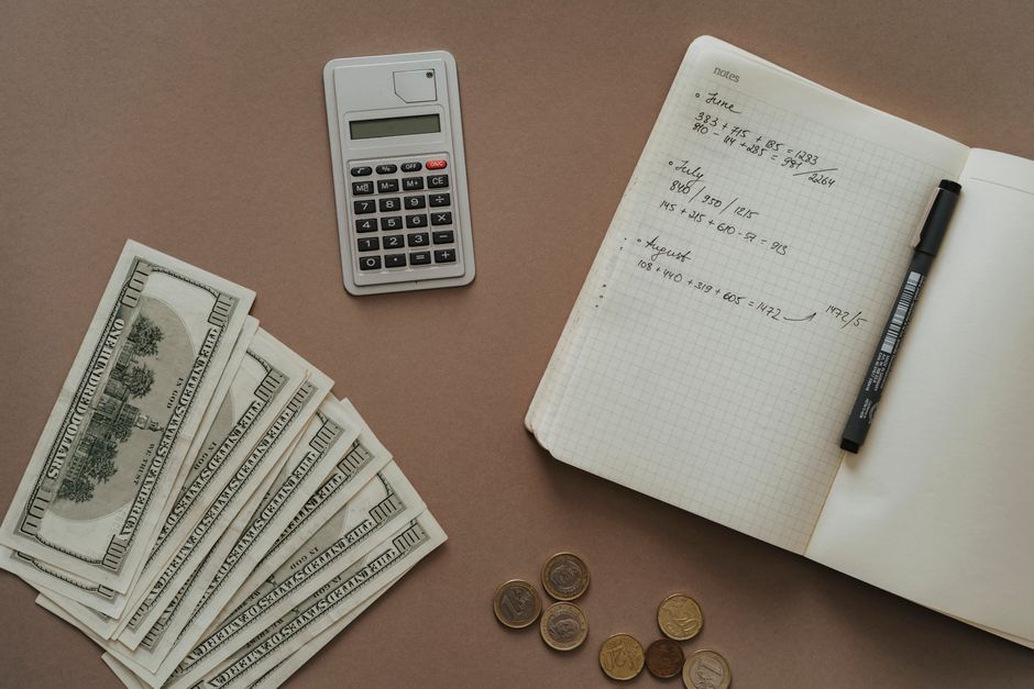 Bills and spending estimates arranged in a notebook