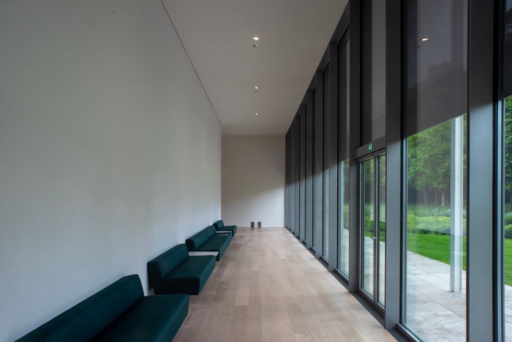 Open gallery space with benches and soft light