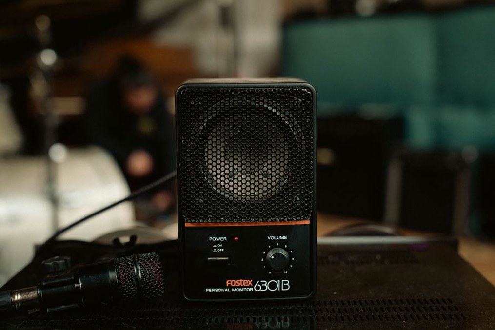 A recorder facing a compact performance space