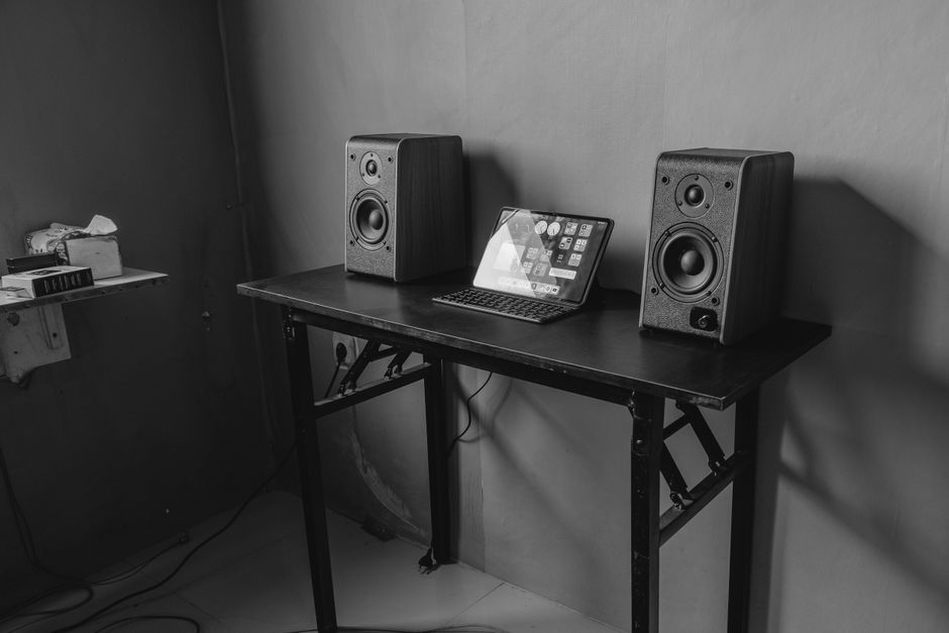 Two speakers facing an uncluttered listening space
