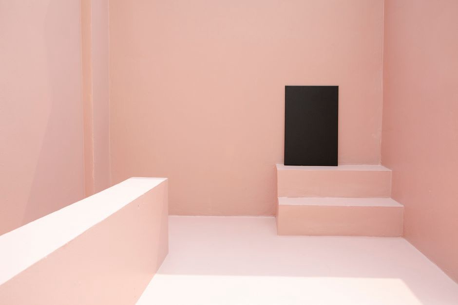 Speaker positioned near a gallery wall